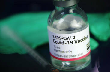 Vaccine Covid-19 dose glass vial and syringe