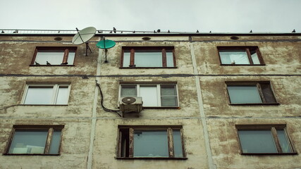 Fototapeta na wymiar The top of the Soviet building in distortion