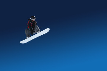Naklejka na ściany i meble Snowboarder female athlete extreme jump flight isolated on blue gradient. Designer stub