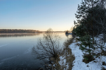 Ice on the Uvod reservoir on a sunny winter day, Ivanovo region.