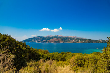 Fototapeta na wymiar View from Albanian coast to Corfu island, Greece. Beautiful Ionian sea landscape.