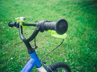 bike parts for teen boy standing in the summer park outdoors, wheel closeup