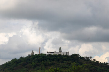 Fototapeta na wymiar A temple above mountain under sky