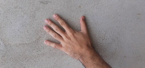 Hand on wall