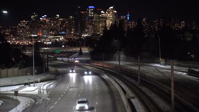 Commuters in their vehicles at night leaving downtown Calgary Alberta Canada on Bow Trail.