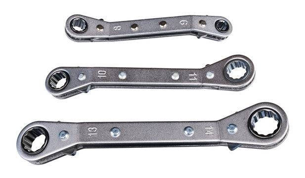 Set of ratcheting box-end wrenches or ring spanners isolated on white background. Close-up of double head ratchet handles. Three various sized metal hand tools for screwing and tightening nut or bolt.