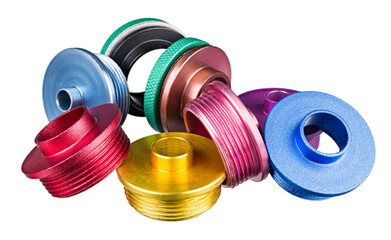 Colored shank guide bushings or green nut router templates isolated on white background. Closeup of...