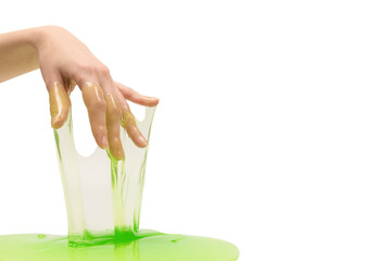 Green slime toy in woman hand isolated on white background.