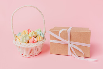 Fototapeta na wymiar Gifts with sweets on isolated pink background, love and valentine concept