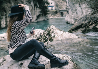 person sitting on a rock