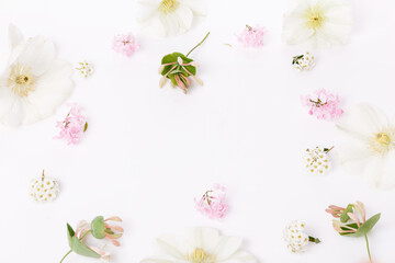 A festive composition of delicate pink and white spring flowers, Flat lay, top view, copy space