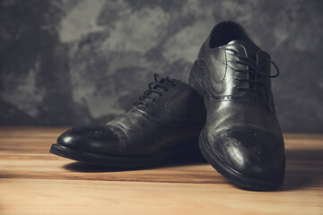man black shoes on grey background