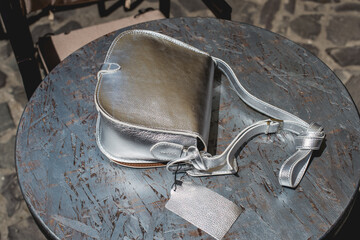 Festive evening small silver bag. Luxury accessories and party concept.