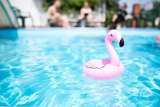 Pink Flamingo Cup Holder Swimming Pool Summer Bright Colors Copy Space Blurred People On The Background Pool Party