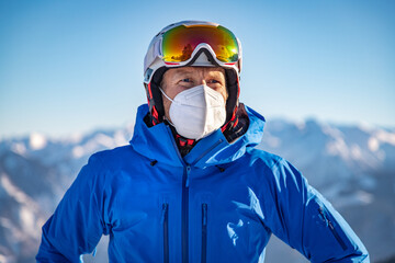 Portrait of a male skier wearing a FFP2 mask