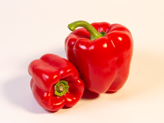 Two sweet red pepper isolated with white background