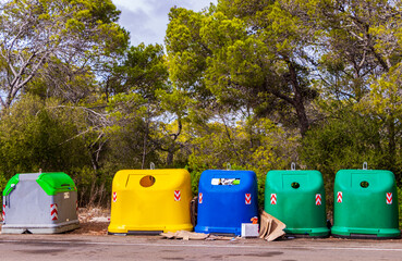Blue green and yellow garbage containers in Mallorca.