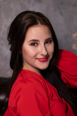Fototapeta premium portrait of attractive brunette woman in red blouse. st valentines