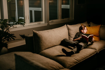 boy at home reading 