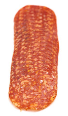 Slices of Spicy Calabrese Salami Meat on a White Background