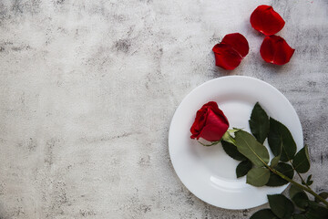 Festive table setting with red roses for valentines day.