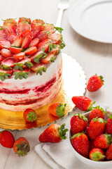 Red velvet cake on white wooden background. with strawberries