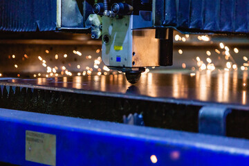 Process of industrial laser cutting of sheet metal.