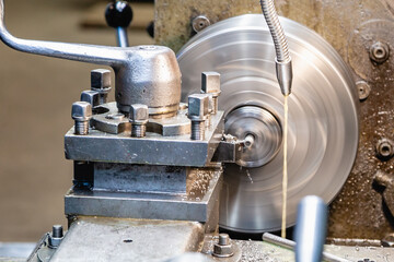 Machining on a lathe, internal boring of a part with a tool.