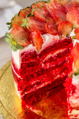 Red velvet cake on white wooden background. with strawberries