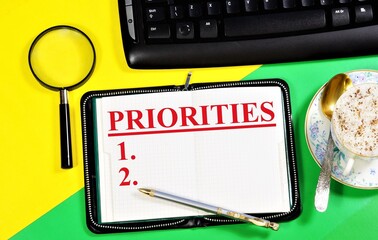 Priorities. The text label in the notebook business of planning. Shows the importance of tasks,...