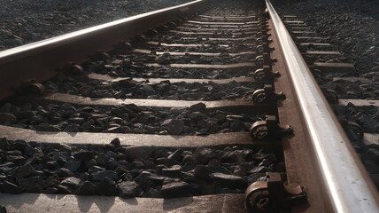 Railroad with concrete cushion and gravel around it