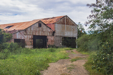 Obraz premium Ruins of an old sugar mill in Salinas, Puerto Rico, USA. Following the. decline of the sugar industry, the shorefront land was acquired by the Jobos Bay National Estuarine Research Reserve. 