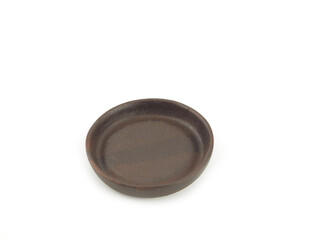 Empty brown old clay saucers, for food use home or restaurant isolated on a white background. Kitchen accessory..