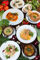 Restaurant serving concept. Traditional Ukrainian dishes - borsch with sour cream, baked potatoes, jellied meat, dumplings, assorted dishes.