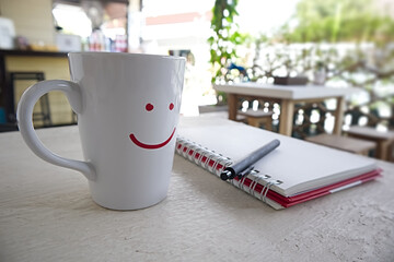 Smile on a coffee mug in a coffee shop