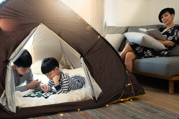 Indoor camping tent - Stay at home activity for family during Covid 19 pandemic lockdown concept....