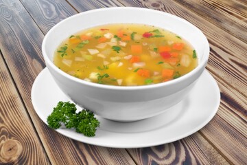 Bowl of delicious vegetable soup on a table