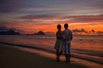 couple on the beach at sunset