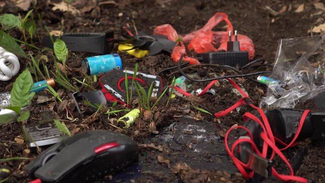 E-waste, WEEE, computer equipment, circuit boards, mice, keyboards, and cell phones, batteries, lamps, scrap components. Soil and water pollution caused by hazardous chemicals and heavy metals