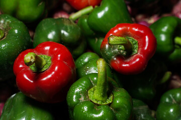 Colorful green and red peppers paprika background. Sweet green peppers background and red pepper. Paprika peppers. Colorful paprika peppers as background, closeup. selective focus, macro photo.