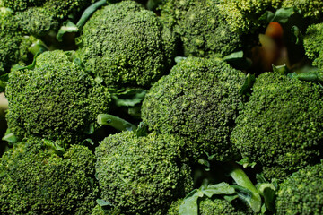 piles of broccoli that are on the market. This vegetable is usually used for additional soup. Fresh green broccoli can be used as an abstract background. vegetables for health.