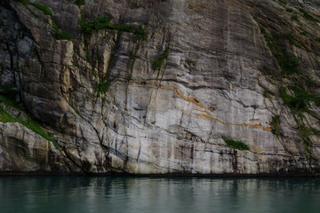 Rock faces along the fjord cliffs and seaside walls of Noway