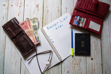 Bucket list written on notebook with use of selective focus