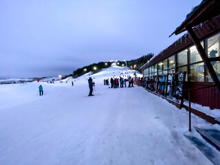 Fedotovo, Russia - January 7, 2021: Ski base, resort. Mountains, People, Skiing, Snowboard
