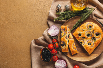 Plate with traditional Italian focaccia on color background