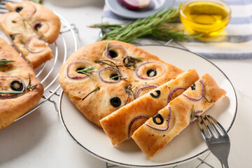 Plate with traditional Italian focaccia on light background