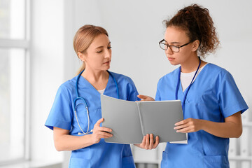 Female doctors discussing diagnosis in clinic