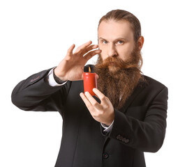 Male fortune teller with candle on white background