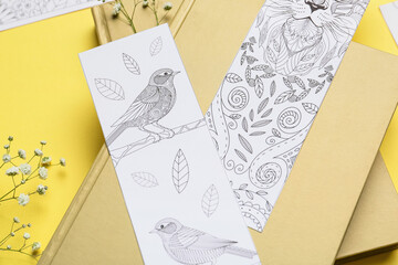 Cute bookmarks with books on color background