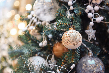 Decorated Christmas tree on blurred, sparkling and fairy background